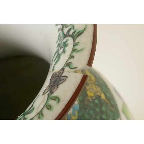 20 - An antique Kutani vase with butterfly handles, decorated with an extensive landscape, Fuku mark to b... 