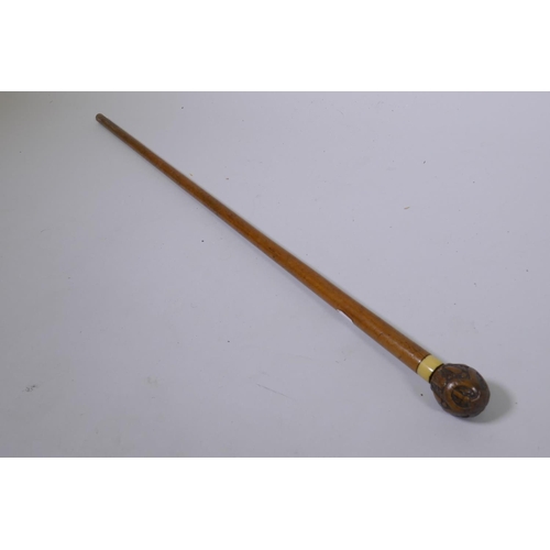 21 - Antique walking cane with wood handle, carved with a spider's web, 84cm long