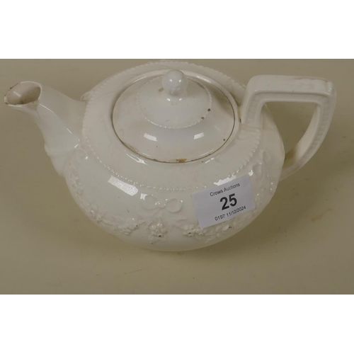 25 - A C19th Staffordshire creamware tea pot with raised swag and bow decoration, 10cm high