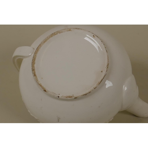 25 - A C19th Staffordshire creamware tea pot with raised swag and bow decoration, 10cm high