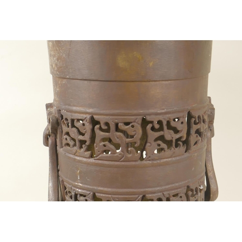 27 - An Oriental bronzed metal table lamp with pierced decoration, 52cm high