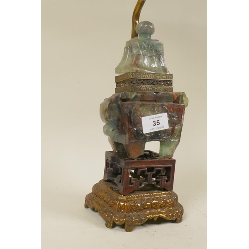 35 - A Chinese carved crystal koro and cover with carved wood stand and metal base, converted to a lamp, ... 