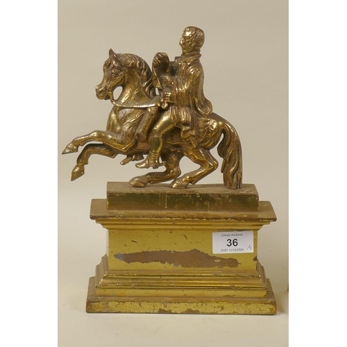 36 - An antique gilt brass doorstop in the form of the Duke of Wellington on horseback, 26cm high, and an... 