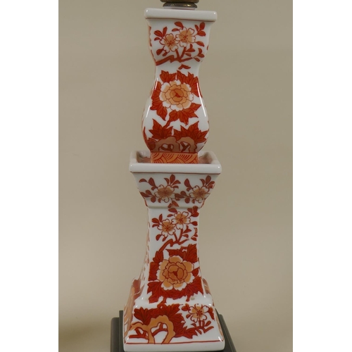 41 - Pair of porcelain table lamps with oriental style decoration raised on wood bases, 50cm high