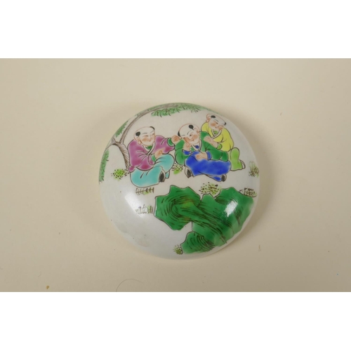 44 - A Chinese famille rose porcelain ginger jar and cover decorated with a festive scene, 23cm high