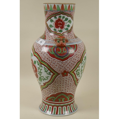 46 - A Chinese Wucai ceramic vase with kylin mounts, 43cm high