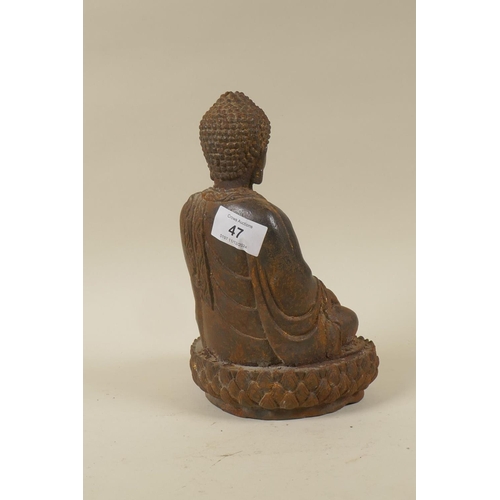 47 - An Oriental cast iron figure of Buddha seated upon a lotus throne, 22cm high