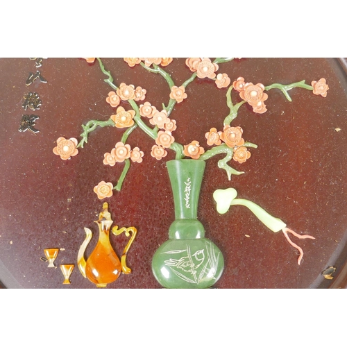 48 - Four Chinese lacquered roundel plaques with raised decoration, AF, 32cm diameter