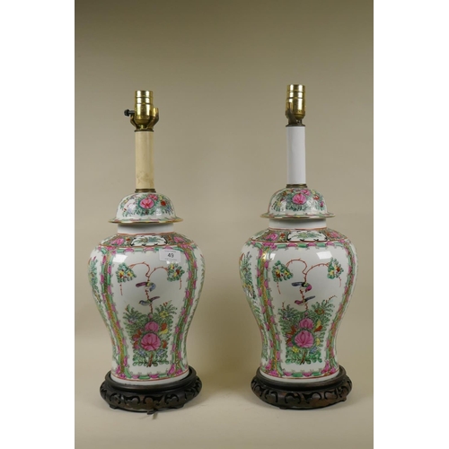 49 - A pair of Chinese Cantonese famille verte ceramic vase table lamps, raised on pierced wood bases, 55... 