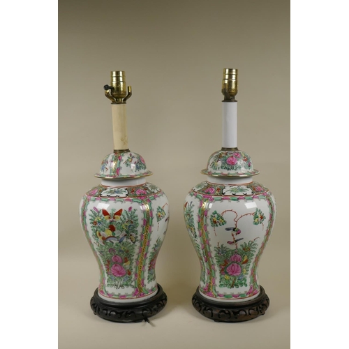 49 - A pair of Chinese Cantonese famille verte ceramic vase table lamps, raised on pierced wood bases, 55... 