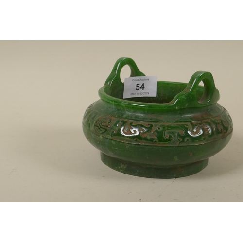 54 - A Chinese green hardstone two handled censer, the body with carved archaic style decoration, 14cm di... 