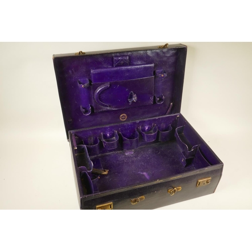 58 - An antique Finnigans of London and Manchester leather vanity case with fitted interior, labelled ins... 