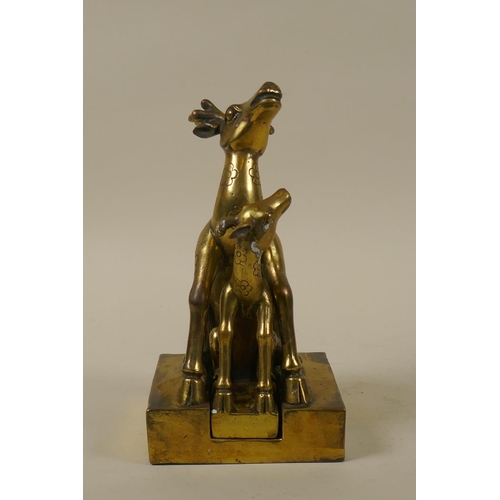 59 - A Chinese brass seal in the form of two deer, 19cm high