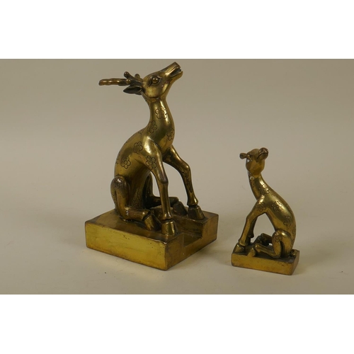 59 - A Chinese brass seal in the form of two deer, 19cm high