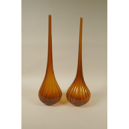 6 - A pair of vintage Bohemian hand blown amber glass tear drop shaped vases of ribbed form with long sl... 