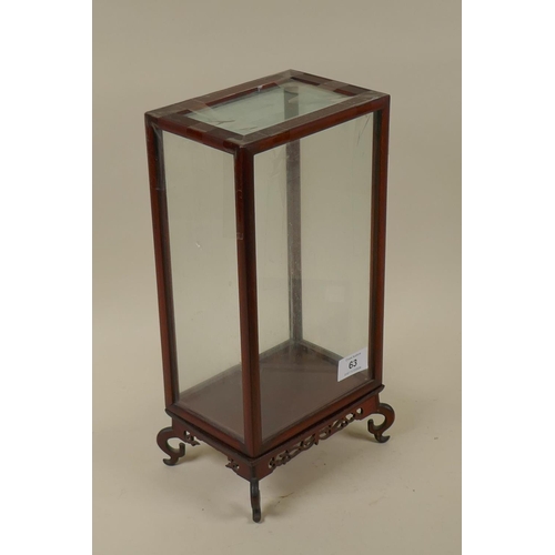 63 - A Chinese table display cabinet raised on a pierced wood base, 18 x 13 x 34cm