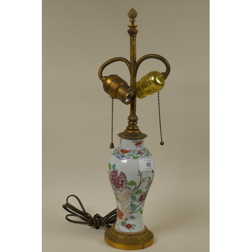 65 - Oriental style ceramic vase with enamelled floral decoration and ormolu mounts, 44cm high