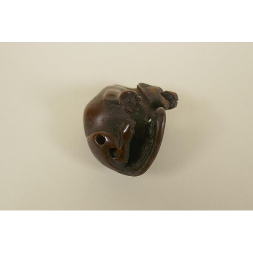 66 - A Japanese Meiji carved boxwood okimono tiger, 4cm, AF loss to ear