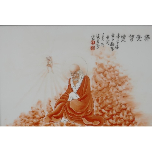 68 - A Chinese porcelain plaque depicting a red robed Lo-han, mounted in a hardwood frame, 45 x 34cm