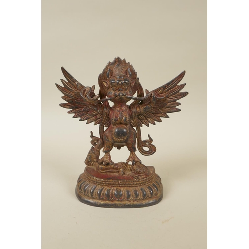 72 - A Tibetan gilt bronzed metal Garuda, double vajra mark to base, 18cm high