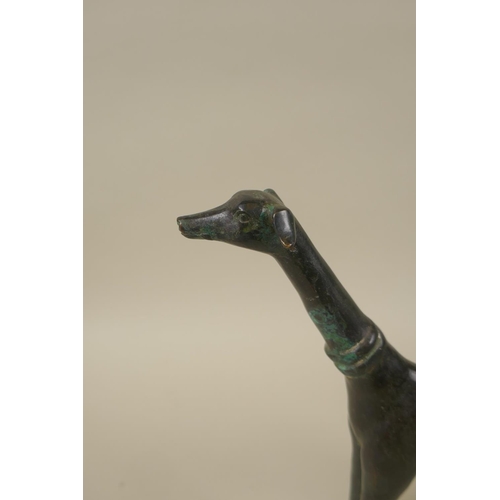 79 - A stylised filled bronze greyhound, 22cm high