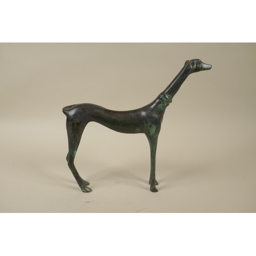 79 - A stylised filled bronze greyhound, 22cm high