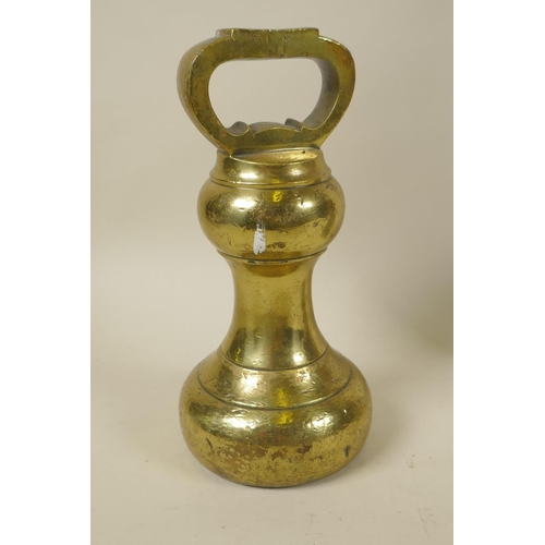 86 - A Victorian brass 14lb bell weight, and a painted cast iron eagle and serpent door stop, 35cm high