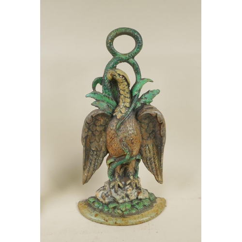 86 - A Victorian brass 14lb bell weight, and a painted cast iron eagle and serpent door stop, 35cm high