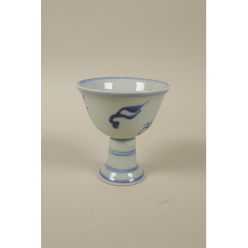 92 - A Chinese blue and white porcelain stem cup decorated with a dragon, Xuande 6 character mark to base... 