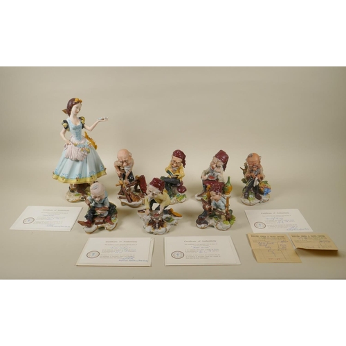 98 - A set of eight Capodimonte porcelain figures of Snow White and the Seven Dwarfs, 30cm high, some wit... 