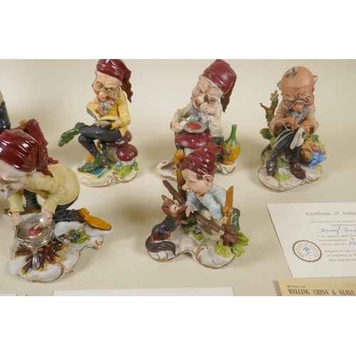 98 - A set of eight Capodimonte porcelain figures of Snow White and the Seven Dwarfs, 30cm high, some wit... 