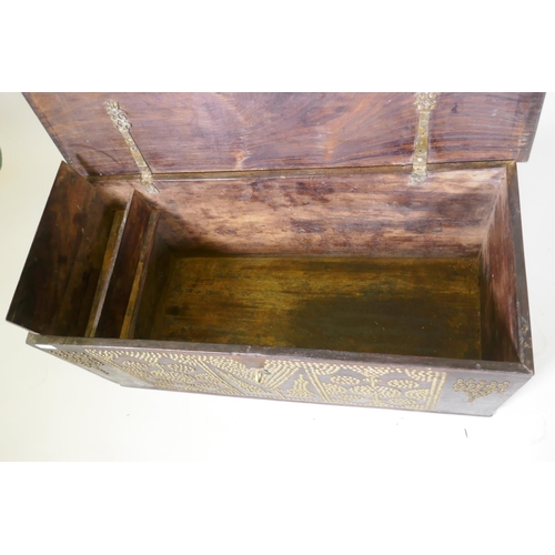 1002 - A Zanzibar hard wood chest with brass stud decoration and carrying handles, 101 x 45 x 44cm