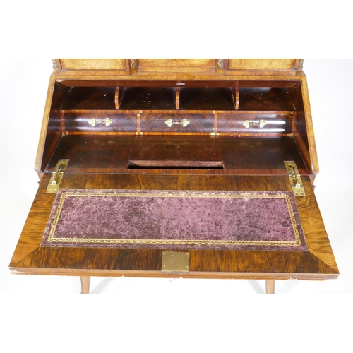 1005 - A Victorian inlaid burr walnut bureau de dame with ormolu mounts, shaped mirror flanked by two glaze... 