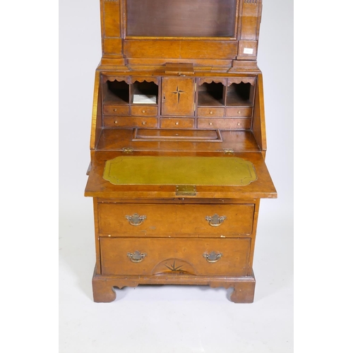 1017 - A Queen Anne style burr walnut dome top bureau bookcase, the upper section with broken arch pediment... 