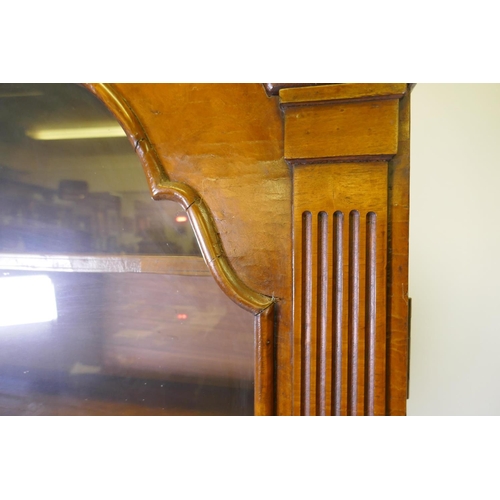 1017 - A Queen Anne style burr walnut dome top bureau bookcase, the upper section with broken arch pediment... 