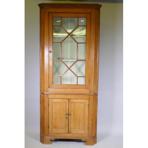 1019 - George III stripped pine corner display cabinet, the upper section with dentil cornice over a single... 