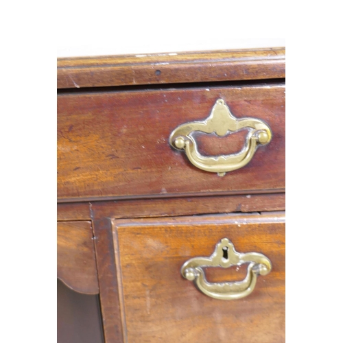 1020 - An C18th Georgian mahogany kneehole desk with moulded edge top over seven drawers and central recess... 