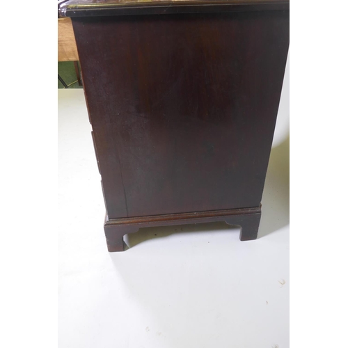 1020 - An C18th Georgian mahogany kneehole desk with moulded edge top over seven drawers and central recess... 