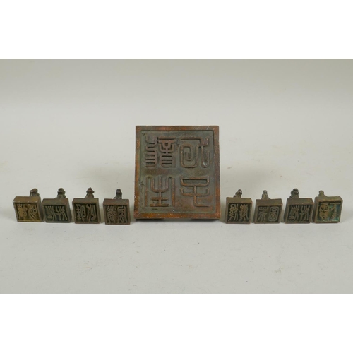 103 - A Chinese bronze kylin seal set with eight smaller kylin seals, 8x 9cm