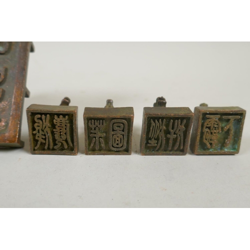 103 - A Chinese bronze kylin seal set with eight smaller kylin seals, 8x 9cm