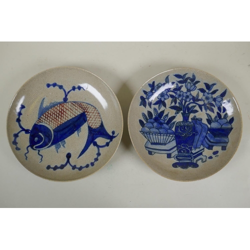 105 - A Chinese blue and white crackleware dish decorated with a carp, and another similar decorated with ... 