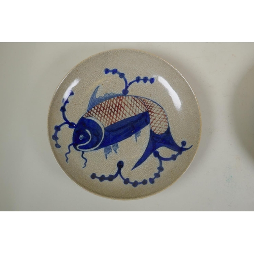 105 - A Chinese blue and white crackleware dish decorated with a carp, and another similar decorated with ... 