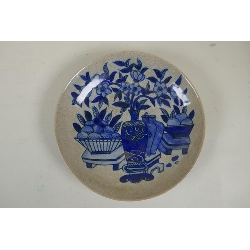 105 - A Chinese blue and white crackleware dish decorated with a carp, and another similar decorated with ... 