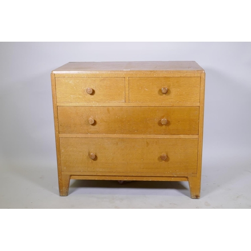 1055 - Mid century light oak Air Ministry dressing table/chest, two over two drawers, raised on shaped supp... 