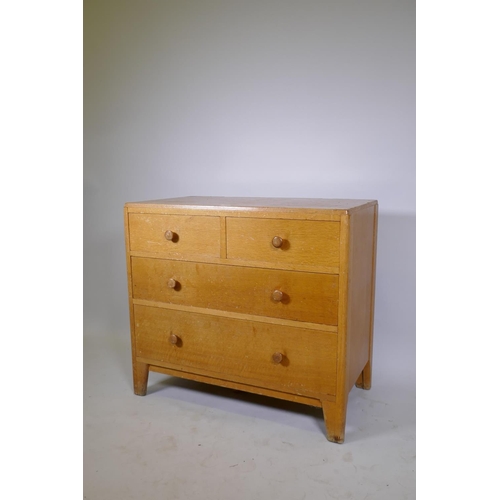 1055 - Mid century light oak Air Ministry dressing table/chest, two over two drawers, raised on shaped supp... 