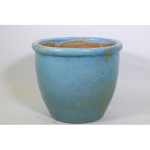 1064 - A blue glazed terracotta garden jardiniere, 64cm diameter, 50cm high