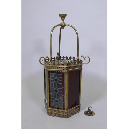 1072 - A brass hexagonal shaped hanging ceiling lantern with inset coloured and stained glass panels, 34 x ... 