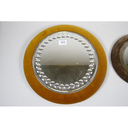 1075 - A Victorian circular cut glass wall mirror on a velvet covered mount, 40cm diameter, and another sma... 