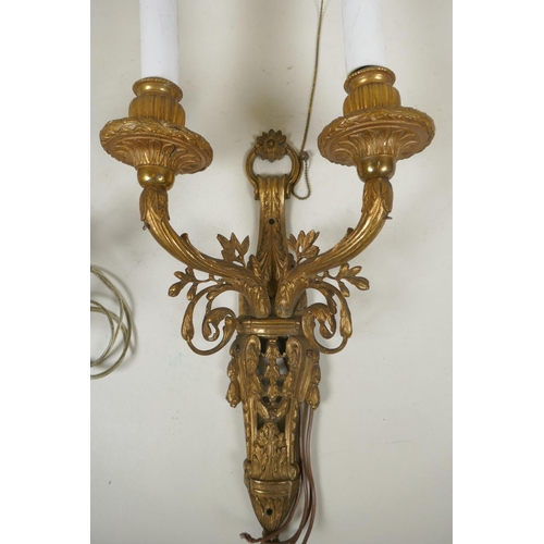 1084 - A pair of French bronze two branch wall sconces, wired for electricity, 53cm long