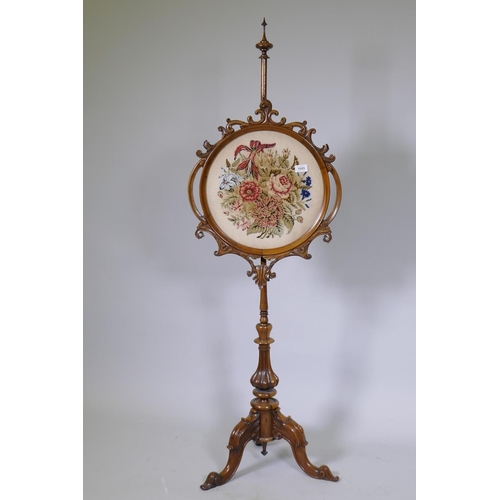 1085 - Victorian walnut adjustable pole screen with inset embroidered panel, raised on a carved column and ... 